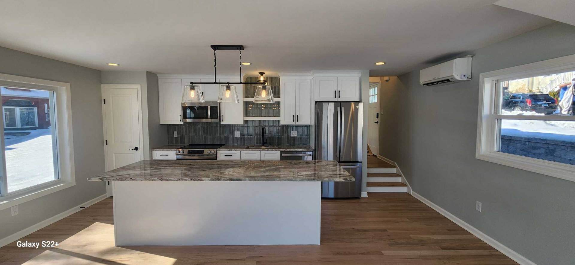 Modern kitchen with island and pendant lights | Connecticut home renovations | Sunwood