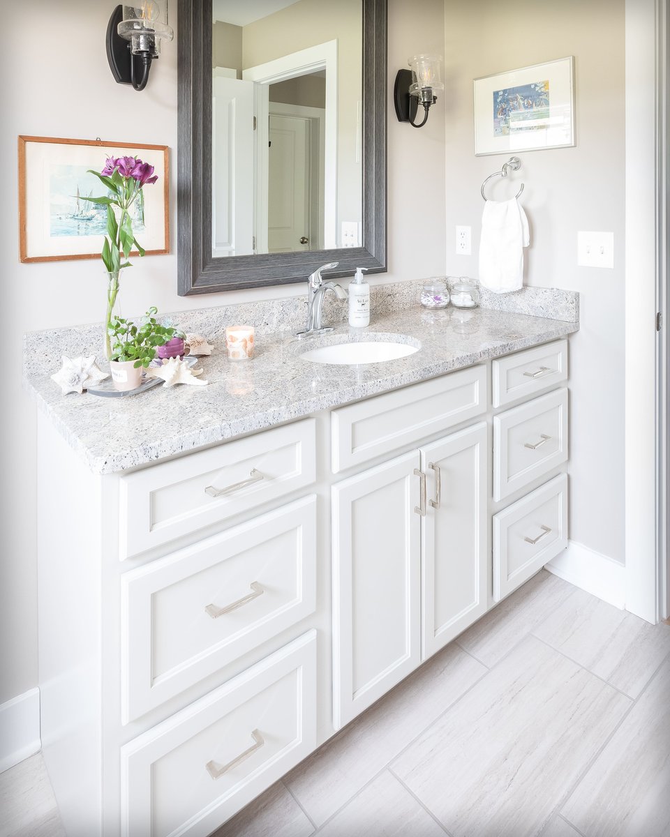 Guest Bathroom with Single Sink Vanity and Grey Marble Counter Top  | Sunwood Home Builders & Remodelers
