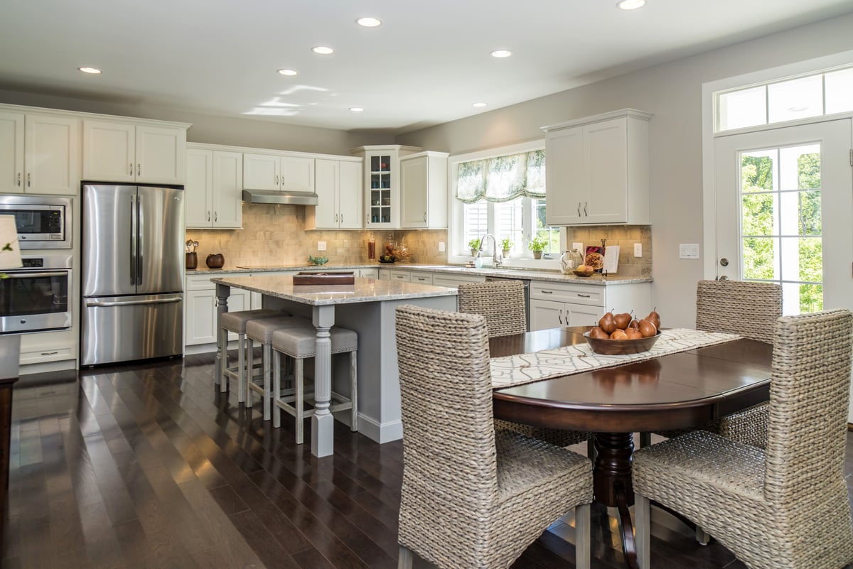 Dark Wood Kitchen Table and Freshly Remodeled Kitchen  | Sunwood Home Builders & Remodelers