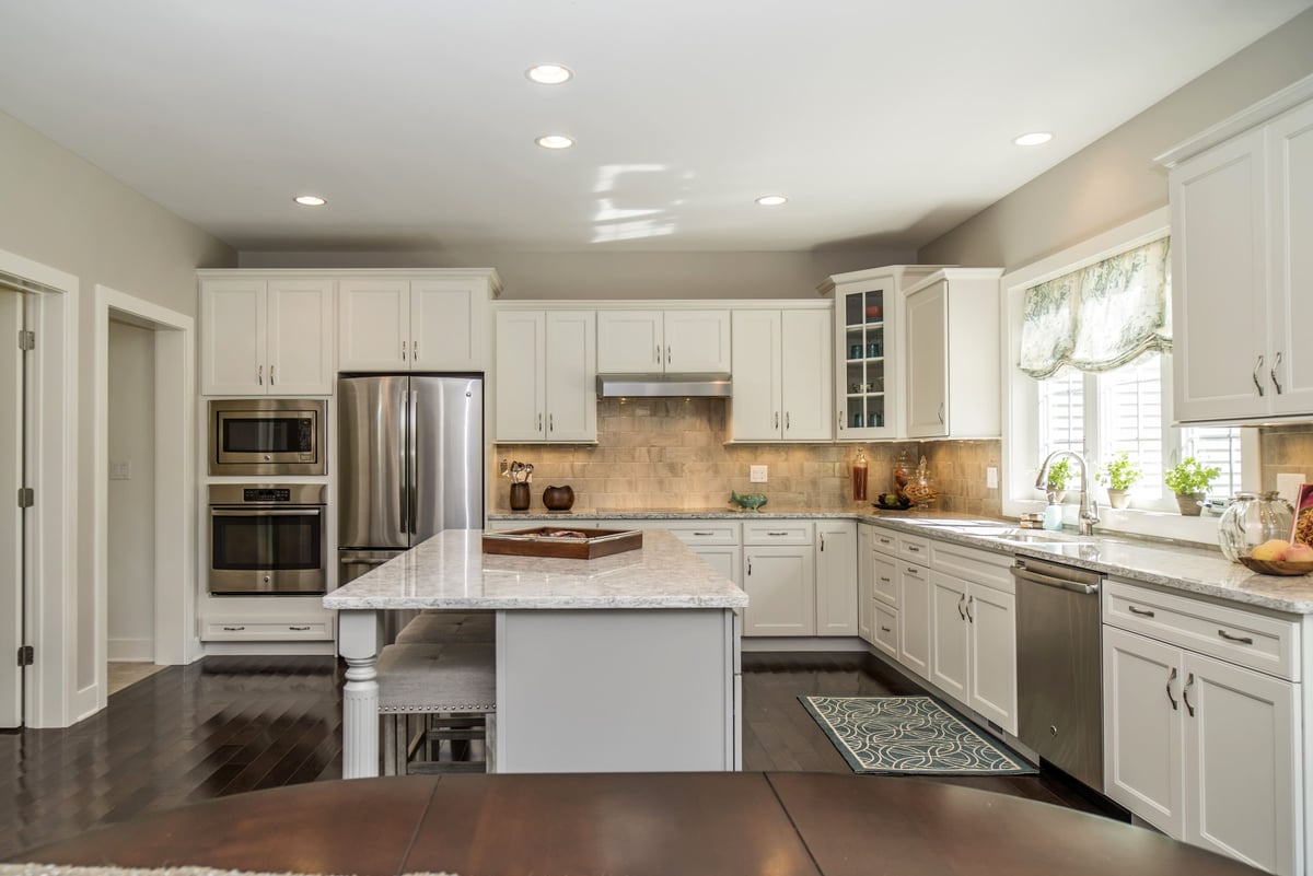 Full Remodeled Kitchen with Soft White Cabinetry and a Farmhouse Style  | Sunwood Home Builders & Remodelers