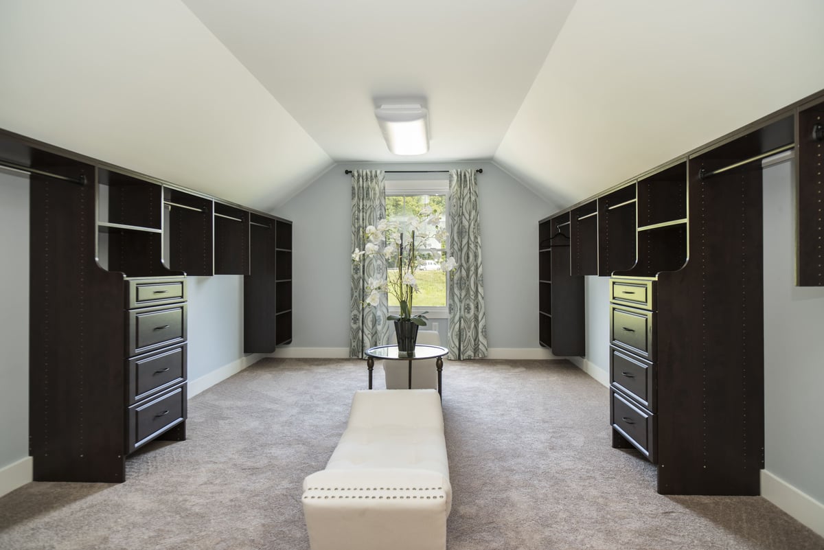 Large Double Walk-In Closet with Lounge Bench  | Sunwood Home Builders & Remodelers