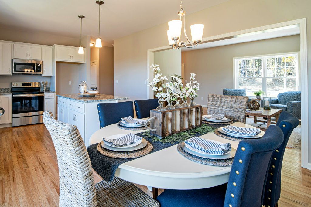 Beautifully Set Kitchen Table with Fully Renovated Kitchen | Sunwood Home Builders & Remodelers
