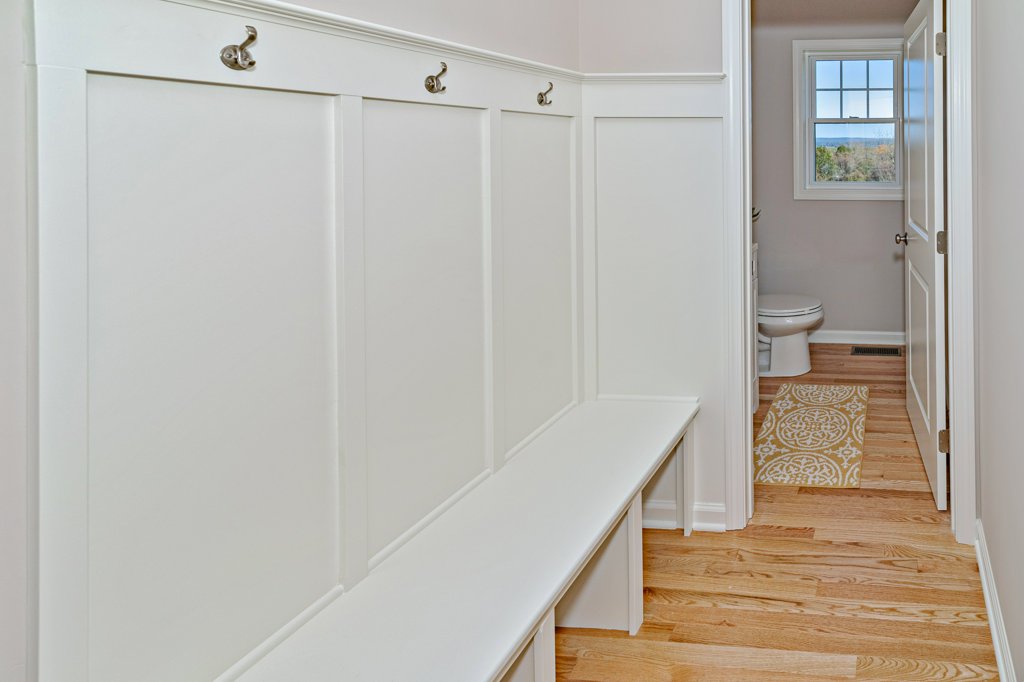 Hallway Leading with Coat Hooks to Guest Bathroom  | Sunwood Home Builders & Remodelers